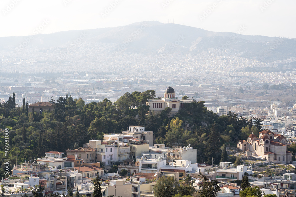 Naklejka premium The beautiful city of Athens with iconic white houses.