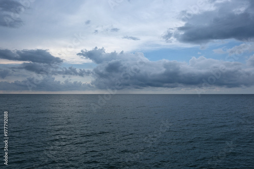 Seascape with stormy clouds over the sea. Nature composition.