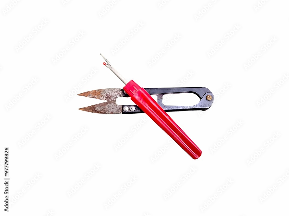 Steel sewing scissor and Seam ripper with red plastic handle isolated on white background. Thread clipper, yarn cutter. craft sewing. Embroidery concept Steel sewing scissor and Seam ripper with red plastic handle isolated on white background. Thread clipper, yarn cutter. craft sewing. Embroidery concept