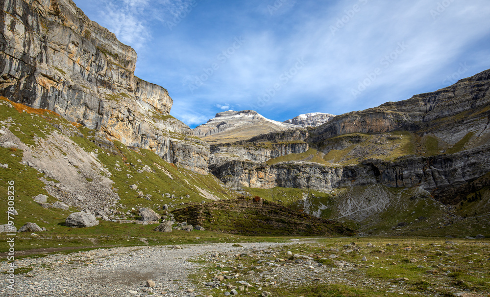 Autumn landscape in the Ordesa y Monte Perdido national park in the Pyrenees, in Huesca, Aragon, Spain, with high mountains Autumn landscape in the Ordesa y Monte Perdido national park in the Pyrenees, in Huesca, Aragon, Spain, with high mountains