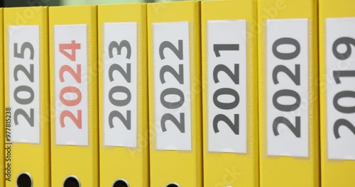 Yellow folders with dates from 2016 to 2028