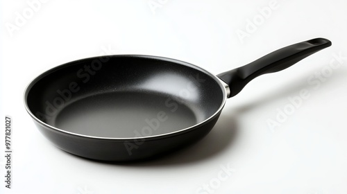 Isolated on white background, a black skillet with a fry pan design. This high-res stock image offers a clear clipping path for easy editing, making it perfect for commercial use. 