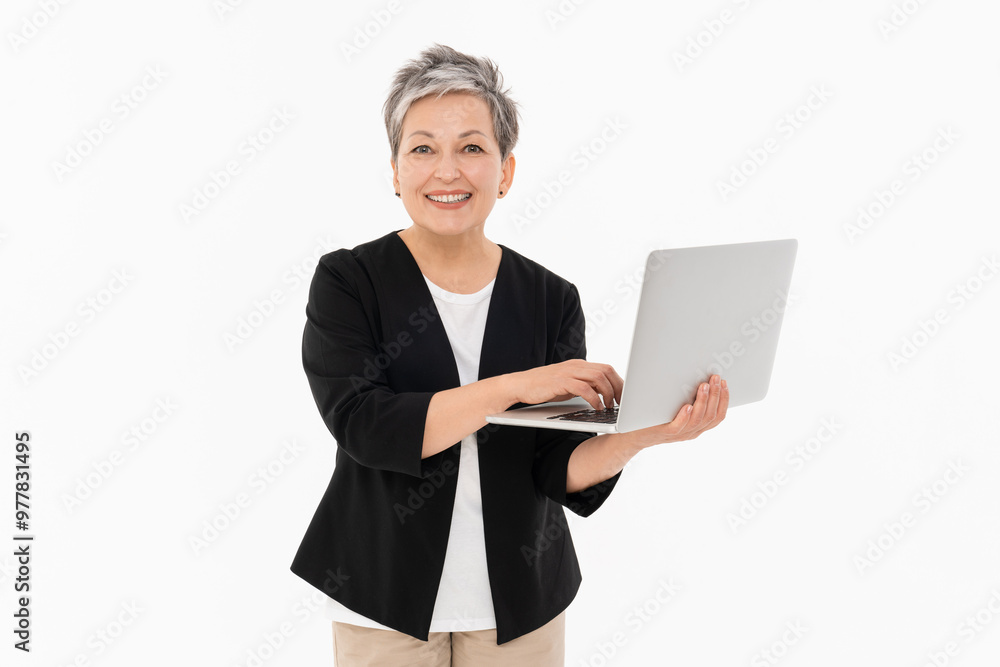 Image of adult mature business woman female manager boss wearing office clothes using holding keeping laptop computer isolated over white background looking at camera Image of adult mature business woman female manager boss wearing office clothes using holding keeping laptop computer isolated over white background looking at camera