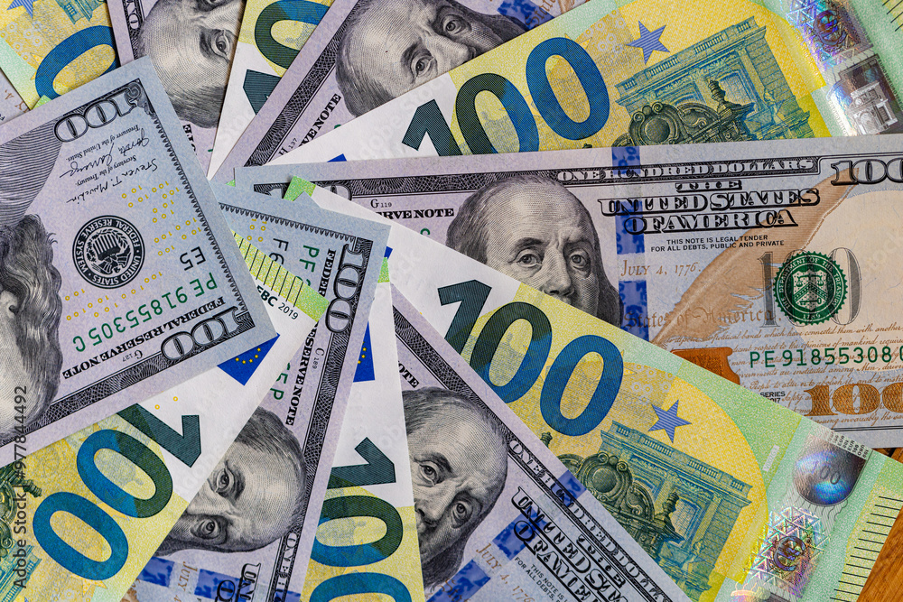 US 100 dollar and 100 euro banknotes background for design purpose US 100 dollar and 100 euro banknotes background for design purpose