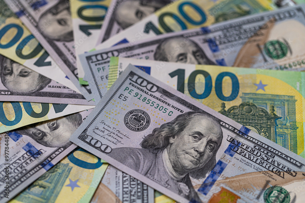 US 100 dollar and 100 euro banknotes background for design purpose US 100 dollar and 100 euro banknotes background for design purpose