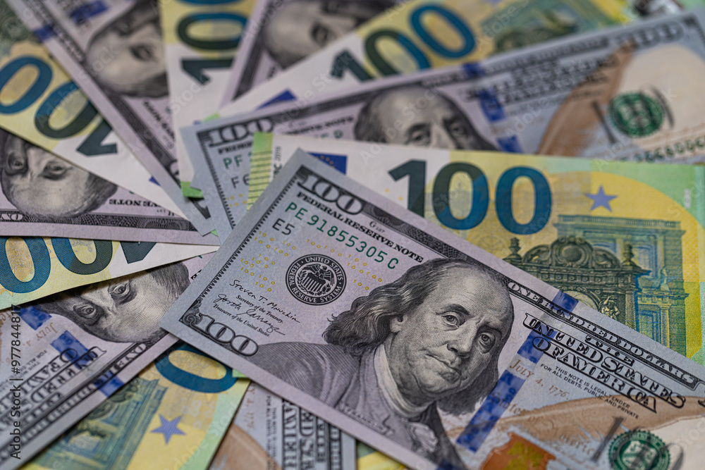 US 100 dollar and 100 euro banknotes background for design purpose US 100 dollar and 100 euro banknotes background for design purpose