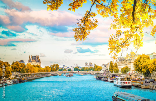 Pris cityscape with Notre Dam spires, Orsay museum, Louvre, passerelle Leopold Senghorl and river Siene at fall, Paris, France