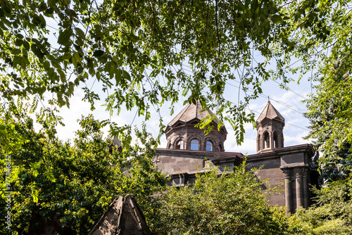 green trees and black tuff Cathedral in Gyumri photo