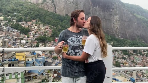 Tourist couple in the Rocinha favela, Rio de Janeiro photo