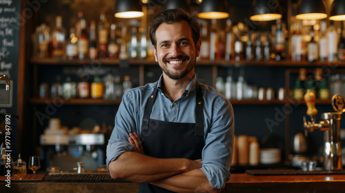 A man standing behind a bar with his arms crossed