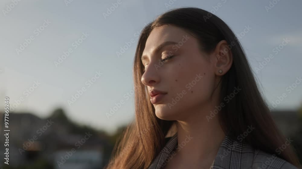 Human Portrait Close-Up of a Beautiful Young Brunette Woman at Sunset with Glowing Sunlight Human Portrait Close-Up of a Beautiful Young Brunette Woman at Sunset with Glowing Sunlight
