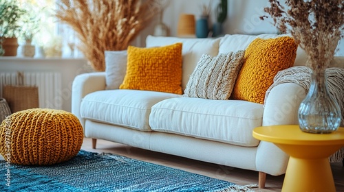 an Stylish living room interior with modern furnishings, including a design sofa, yellow side table, dried flowers, and cozy decor.