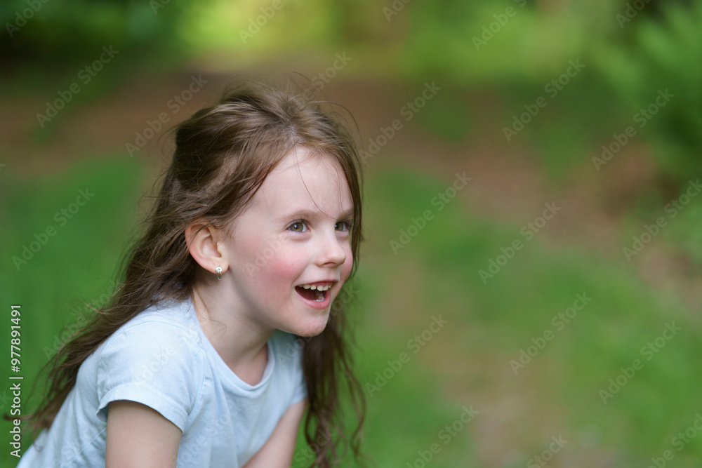 Little beautiful girl on the background of the road in the park. Happy childhood concept outdoors Little beautiful girl on the background of the road in the park. Happy childhood concept outdoors
