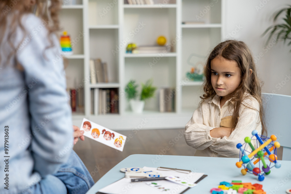 Female speech therapist having a training session with a long-haired girl Female speech therapist having a training session with a long-haired girl