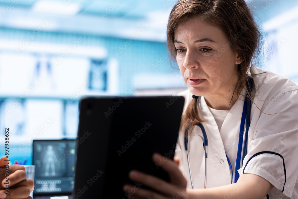 General practitioner presenting the test findings via scan interpretation on tablet, discussing about the diagnostic and possible treatment. Medical expert provides advice to patient. General practitioner presenting the test findings via scan interpretation on tablet, discussing about the diagnostic and possible treatment. Medical expert provides advice to patient.