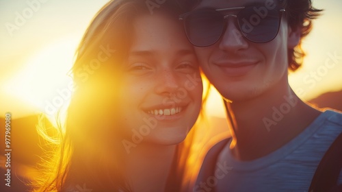 Happy couple enjoying a sunset together, radiating love in golden hour light, creating memories and sharing a moment of connection