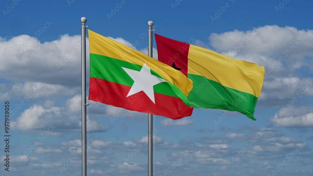 Guinea-Bissau and Myanmar flags flying together, video concept of the relationship, two country relations concept Guinea-Bissau and Myanmar flags flying together, video concept of the relationship, two country relations concept
