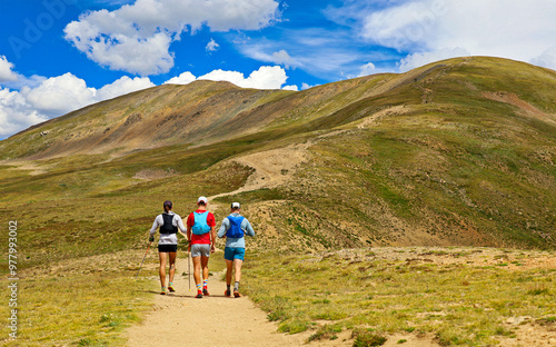 Hikers start their trek to the summit of Colorado's 13,000-foot mount Snikltau (in background).