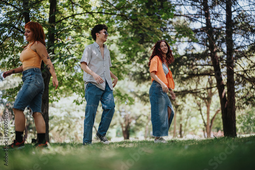 Young teenagers having fun in the park showcasing friendship, joy and moments of laughter and happiness.