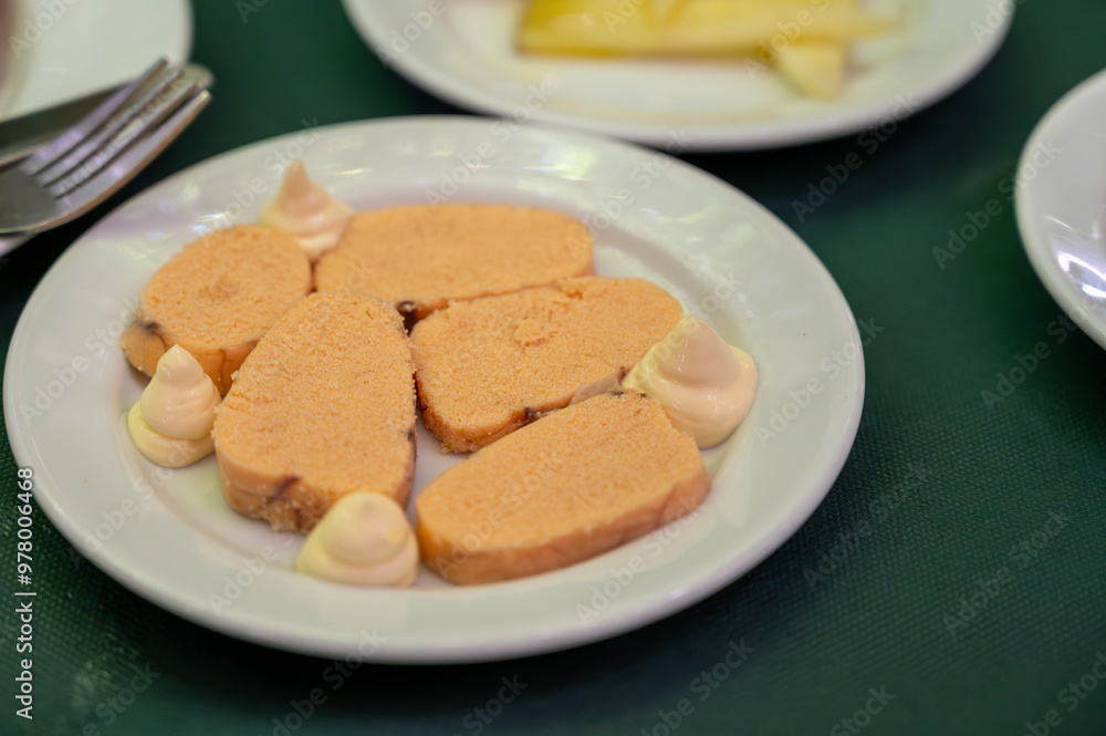 Traditional andalusian dish fish eggs seafood served with mayonnaise sauses in old tavern as tapa, Sanlucar de Barrameda, Spain Traditional andalusian dish fish eggs seafood served with mayonnaise sauses in old tavern as tapa, Sanlucar de Barrameda, Spain