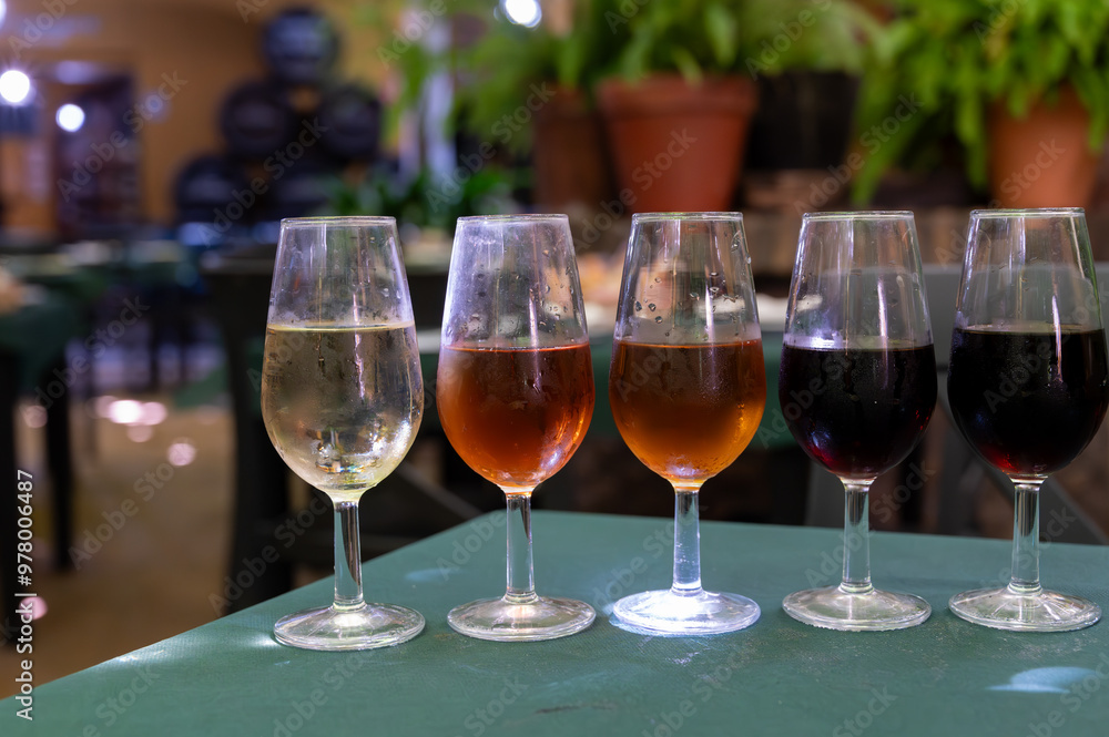 Flight of five sherry wine from barrels, fino, manzanilla, olorosso, amontillado, pedro ximenez jerez wines in old tavern, wine tasting, Sanlucar de Barrameda, Cadiz, Andalusia, Spain Flight of five sherry wine from barrels, fino, manzanilla, olorosso, amontillado, pedro ximenez jerez wines in old tavern, wine tasting, Sanlucar de Barrameda, Cadiz, Andalusia, Spain