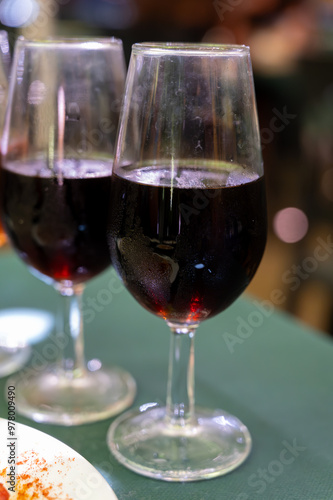 Tasting of sherry wines from barrels, fino, manzanilla, olorosso, amontillado jerez wines with traditional Andalusian tapas in old tavern, Sanlucar de Barrameda, Cadiz, Andalusia, Spain