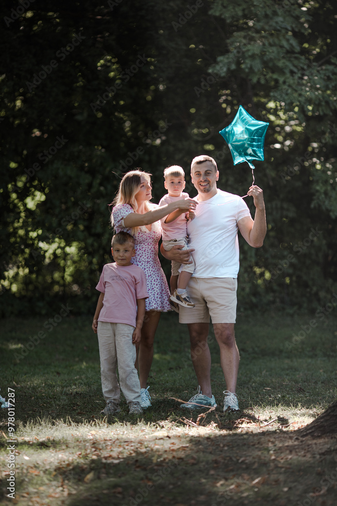 Fototapeta premium Happy family at a birthday party. Cheerful family having fun together
