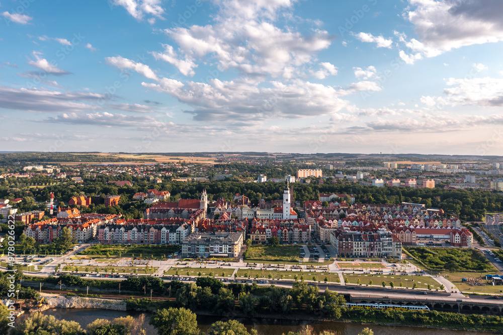Summer aerial skyline cityscape of Głogów, Lower Silesia (Dolny Śląsk). Wide panoramic view of the old town and Bulwar Nadodrzański at sunset