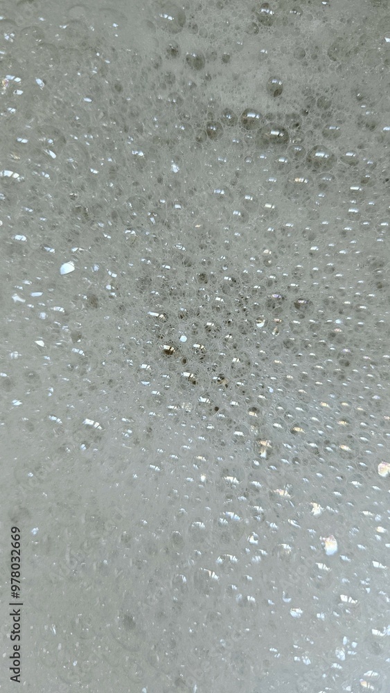 full frame of tiny reflective sudsy water bubbles full frame of tiny reflective sudsy water bubbles