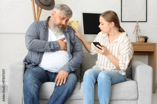 Young woman calling ambulan...