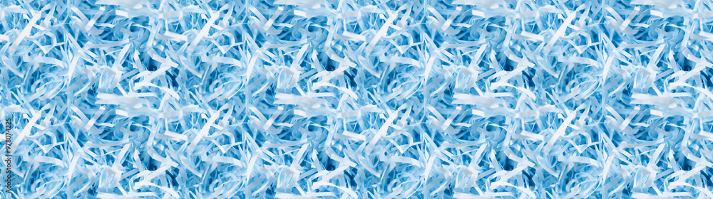 shredded paper filler in baby blue color with thin, delicate strips, shredded paper filler texture background shredded paper filler in baby blue color with thin, delicate strips, shredded paper filler texture background