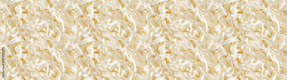 shredded paper filler in vanilla cream color with thin, delicate strips, shredded paper filler texture background