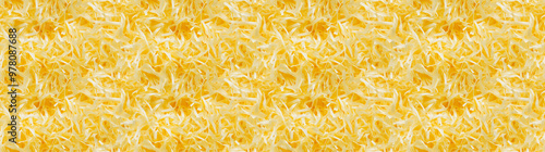 shredded paper filler in yellow color with thin, delicate strips, shredded paper filler texture background photo