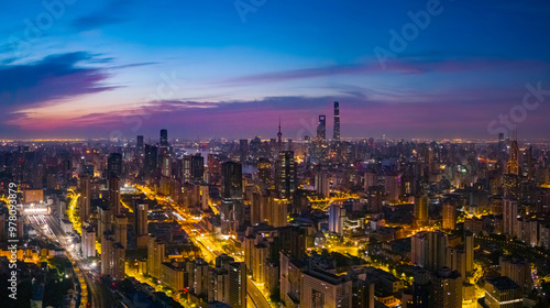 Aerial view of modern city skyline and buildings at sunrise in Shanghai