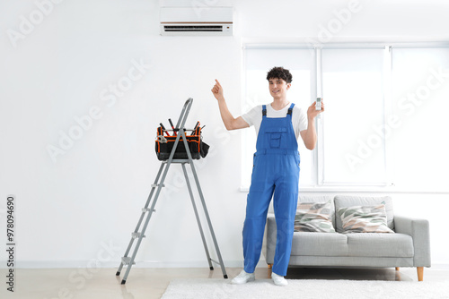 Male worker repairing air c...