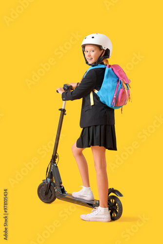 Cute schoolgirl in helmet w...