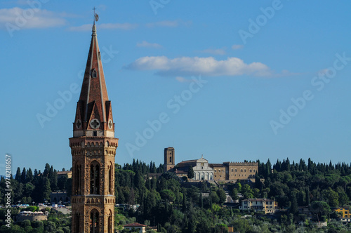 Florence skyline with historic architecture and greenery against clear blue sky photo