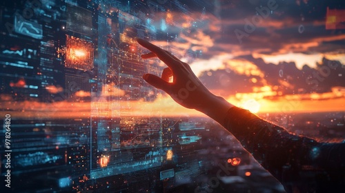 Hand interacting with futuristic data on a digital screen at sunset photo