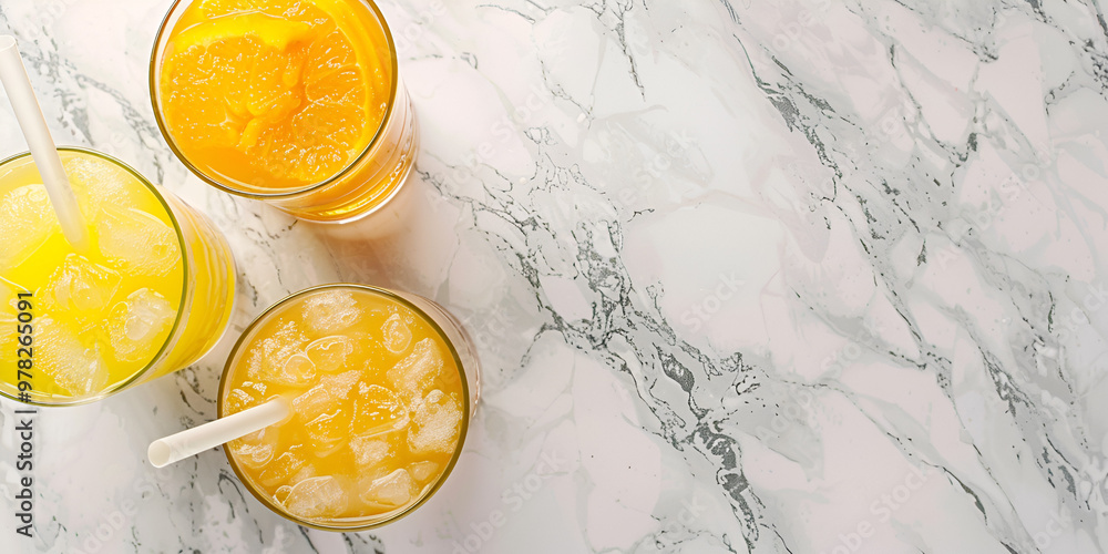 Refreshing Orange Drink in Glass with Ice Refreshing Orange Drink in Glass with Ice