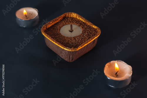 Candle-shaped dessert with chocolate and nuts
