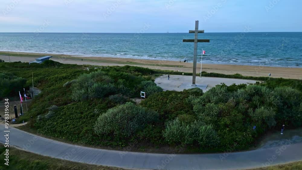 Grand Cross of Lorraine near Courseulles-sur-Mer, Normandy in France. Aerial drone backward Grand Cross of Lorraine near Courseulles-sur-Mer, Normandy in France. Aerial drone backward