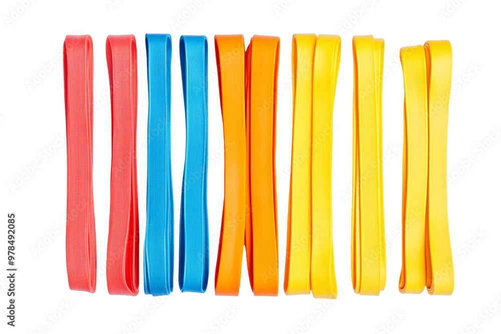 A vibrant arrangement of colorful rubber bands in red, blue, orange, and yellow hues. A vibrant arrangement of colorful rubber bands in red, blue, orange, and yellow hues.