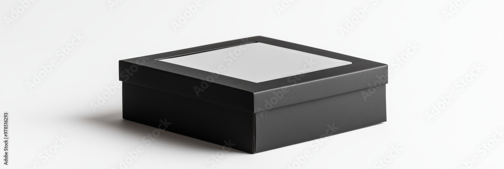A simple, plain black packaging box with a clear window, set against a seamless white background A simple, plain black packaging box with a clear window, set against a seamless white background