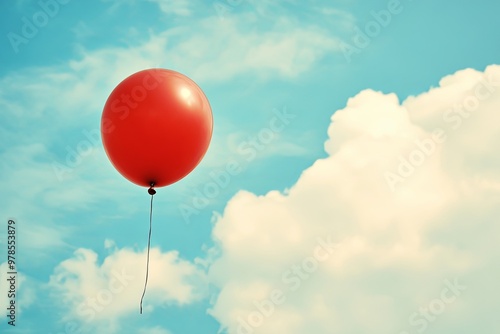 A bright red balloon floats against a clear blue sky with fluffy white clouds during a sunny afternoon in spring. Generative AI