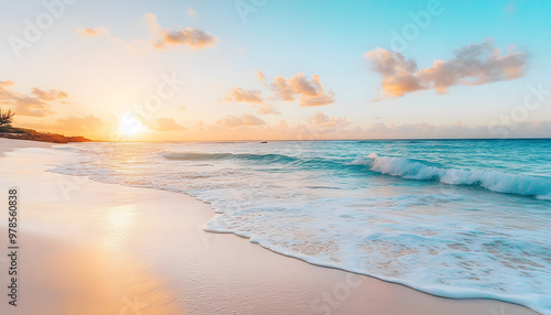 Crystal-clear turquoise waters with gentle waves lapping at a pristine beach under a golden sunset