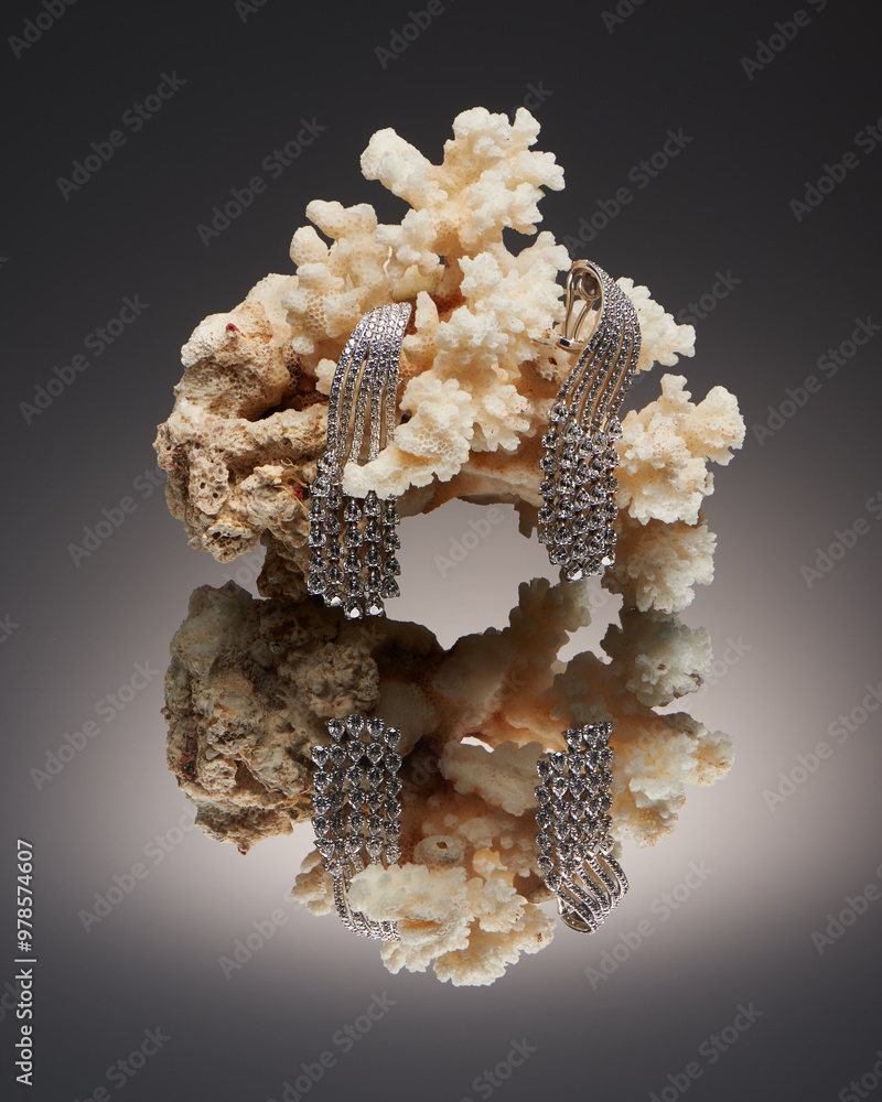 Delicate long earrings with diamonds on coral reef Delicate long earrings with diamonds on coral reef