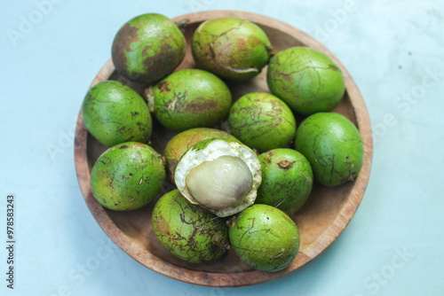 close up of green matoa fruit. Pometia pinnata photo