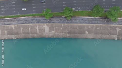 Top down aerial footage panning across the Lakefront Trail in downtown Chicago with a group of runners exercising. photo