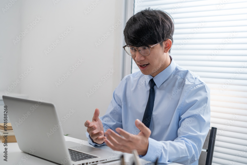 VDO Call Conference Man work from home. talk chat online on video call on laptop webcam conference Asian businessman working online E learning and social distancing. VDO Call Conference Man work from home. talk chat online on video call on laptop webcam conference Asian businessman working online E learning and social distancing.