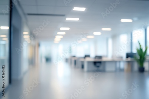 Wallpaper Mural Blurry view of a modern office space with desks and large windows. Torontodigital.ca